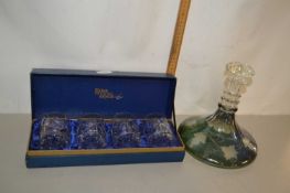 Green tinted flat bottomed decanter and a case of four tumblers