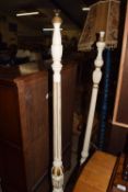 Two white painted standard lamps