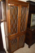 An Old Charm oak lead glazed bookcase cabinet