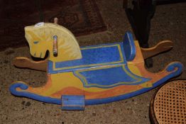 Small painted wooden rocking horse