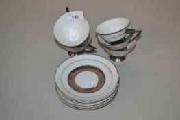 An Art Deco style sterling silver on porcelain part coffee set