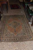 A 20th Century Middle Eastern floor rug, 183cm long