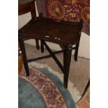 An Oriental style lacquered drinks tray and folding stand, worn condition