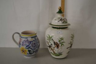 A Poole Pottery jug together with a modern Italian porcelain jar decorated with birds