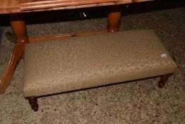 A reproduction rectangular footstool on turned legs, 103cm long