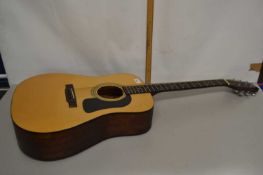 A Washburn acoustic guitar