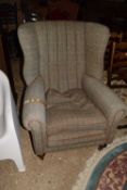 A Tetrad Harris Tweed covered wing back armchair