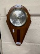 A wall mounted barometer