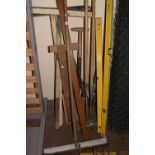 Quantity of assorted tools to include spirit levels, rakes, T squares and others