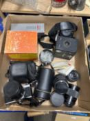 A quantity of various cameras and equipment to include an Olympus OM1 SLR, a Minolta 404SI,