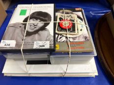 A mixed lot of Beatles memorabilia, books, VHS tapes, trading cards, badges etc