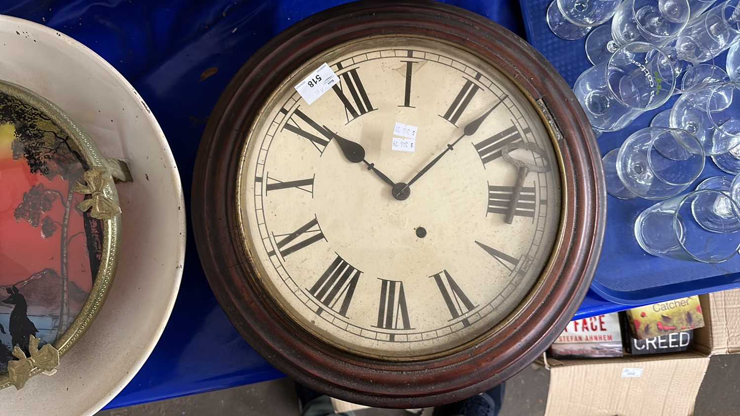 A wall clock with orginal face on reverse