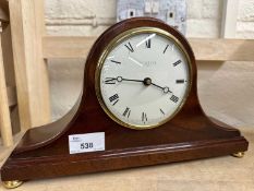 A wooden cased mantel clock