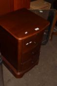 A bedside chest of three drawers