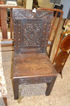 17th Century and later oak side chair with carved panelled back over a boarded seat and a base