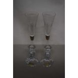 Pair of crystal glass candlesticks together with a pair of long stemmed champagne flutes, hallmarked