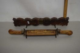 Two Oriental wood mounted carving sets