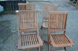 Set of four folding hardwood garden chairs