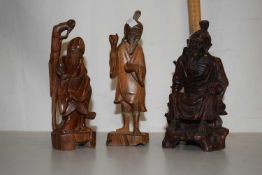 Three small Chinese carved wooden figures