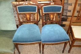 A pair of Edwardian Sheraton Revival side chairs with mahogany frames and inlaid decoration and