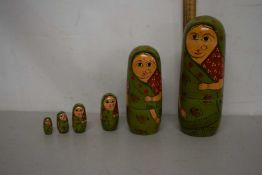 Vintage green painted Russian dolls