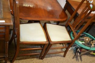 A pair of Edwardian mahogany framed bedroom chairs, together with a further shield back dining chair