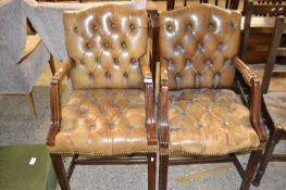 Pair of leather upholstered armchairs