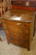 Early 20th century walnut veneered bow front four drawer chest