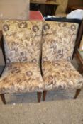 Pair of mid-century low armchairs with floral upholstery