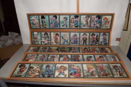 Group of five framed montage prints of comical children after Michell T