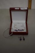 White metal suite of jewellery comprising necklace, bracelet and earrings