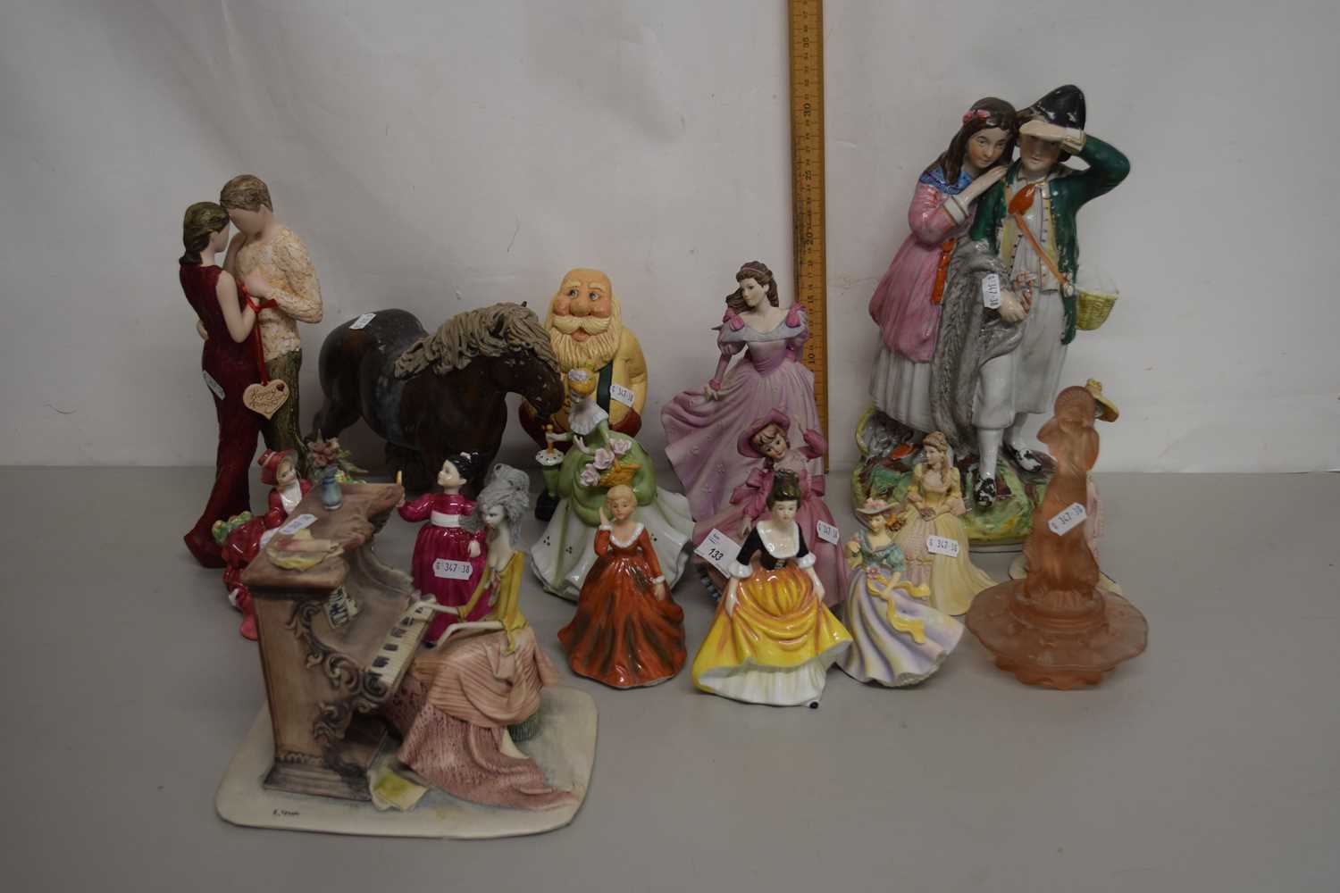 Collection of mixed figurines, pottery model of a horse, a peach glass centrepiece etc