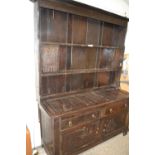 Large oak dresser with carved decoration constructed from period timbers with later amendments,