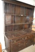 Large oak dresser with carved decoration constructed from period timbers with later amendments,