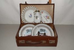 Small leather case containing various crested china wares