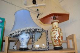 Two table lamps and an easel framed mirror