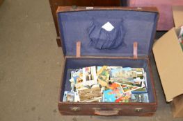 Suitcase and quantity of postcards