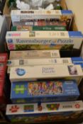 Two boxes of mixed jigsaw puzzles