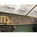 A large two part wooden and gilt painted sign for Baxter & Sons