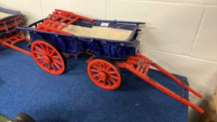 Wooden scratch built model of a Sussex Wagon, painted in red, blue and black, approx 85cm long