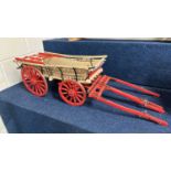 A scratch built model of a Hampshire Wagon painted in beige and red, approx 80cm long