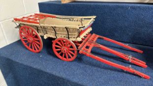 A scratch built model of a Hampshire Wagon painted in beige and red, approx 80cm long