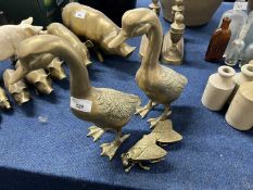 Two brass model ducks, together with two brass flies