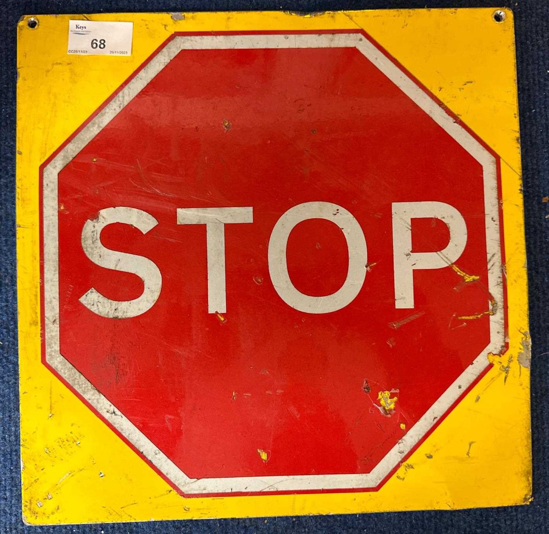 Modern sheet metal sign marked Stop, 30cm square