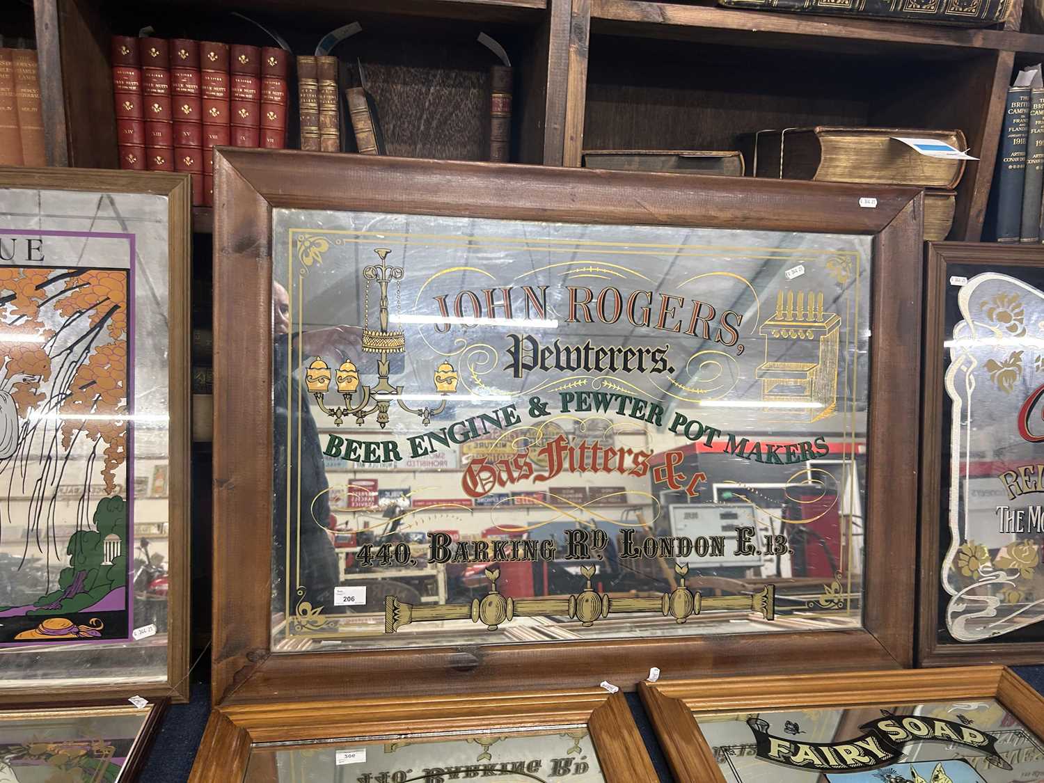 John Rogers Pewterers, 440 Barking Road, London, picture sign in stained pine frame