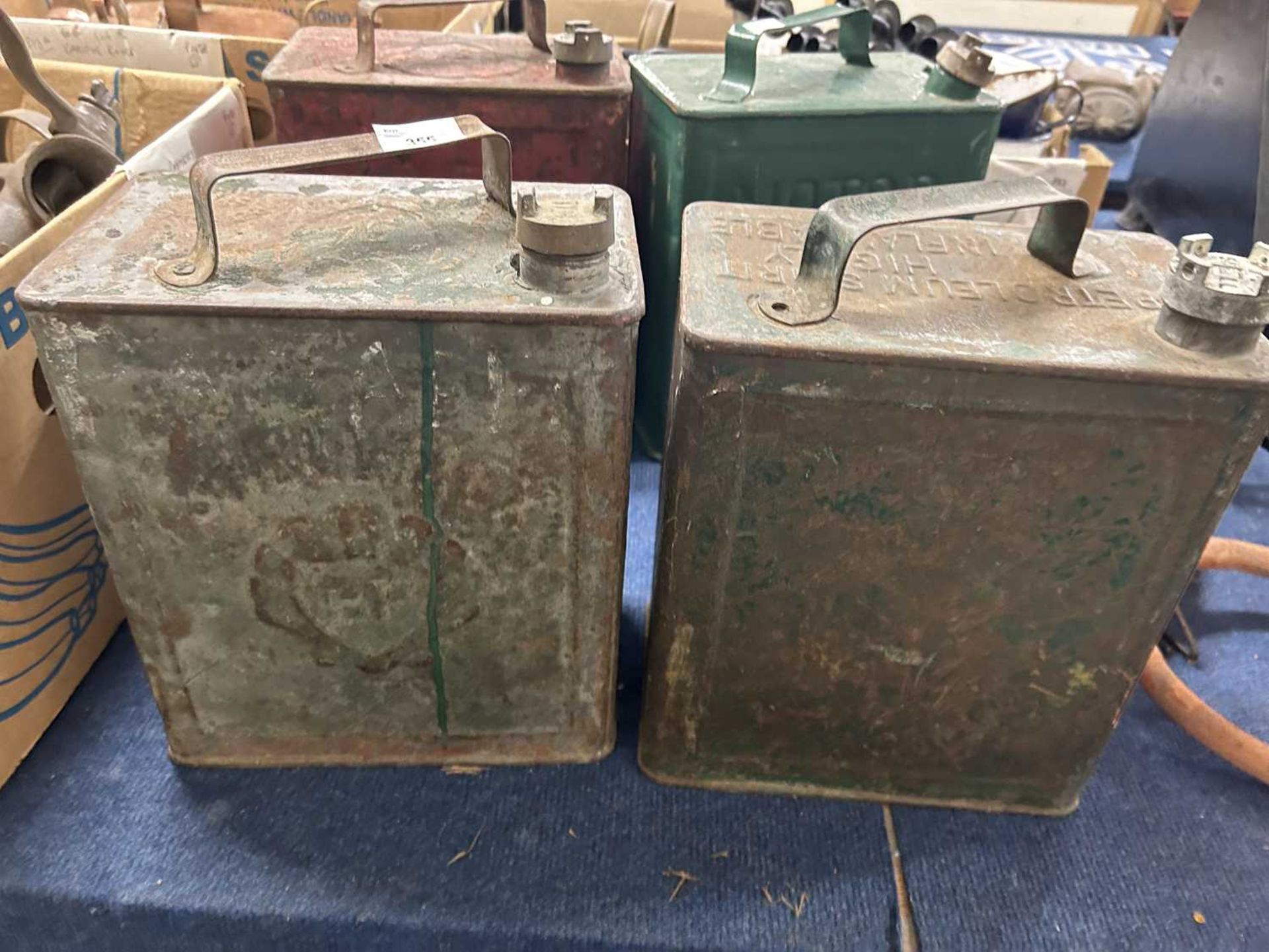 Two vintage petrol cans, one marked 'Shellmex', the other plain