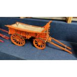 A scratch built model of a Northampton Wagon, painted in orange and black, approx 70c, long in
