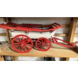 A scratch built model of a Hereford Wagon, painted in red and cream, approx 70cm long in total