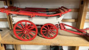 A scratch built model of a Hereford Wagon, painted in red and cream, approx 70cm long in total