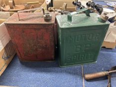 Two vintage petrol cans marked 'Motor Spirit BP' and 'Shell Motor Spirit'